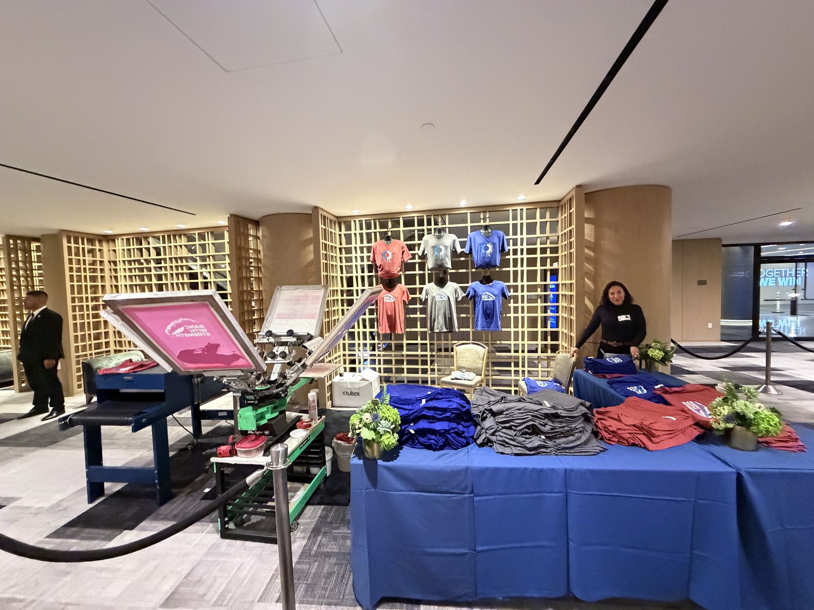 Merch Troop live screen-printing station running at a Tampa event